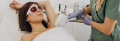 Technician performing laser hair removal treatment