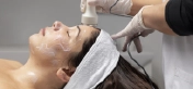 Client receiving a relaxing Hydrafacial skincare treatment