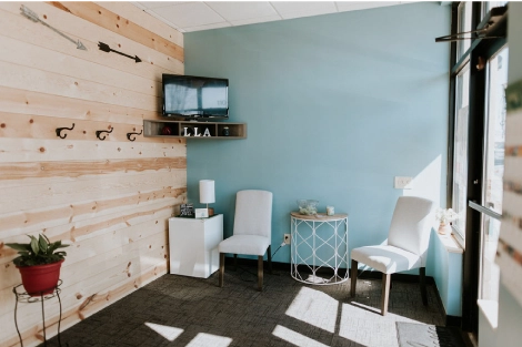 Lotus Laser Aesthetics waiting area with cozy chairs and modern décor, creating a calm and welcoming atmosphere